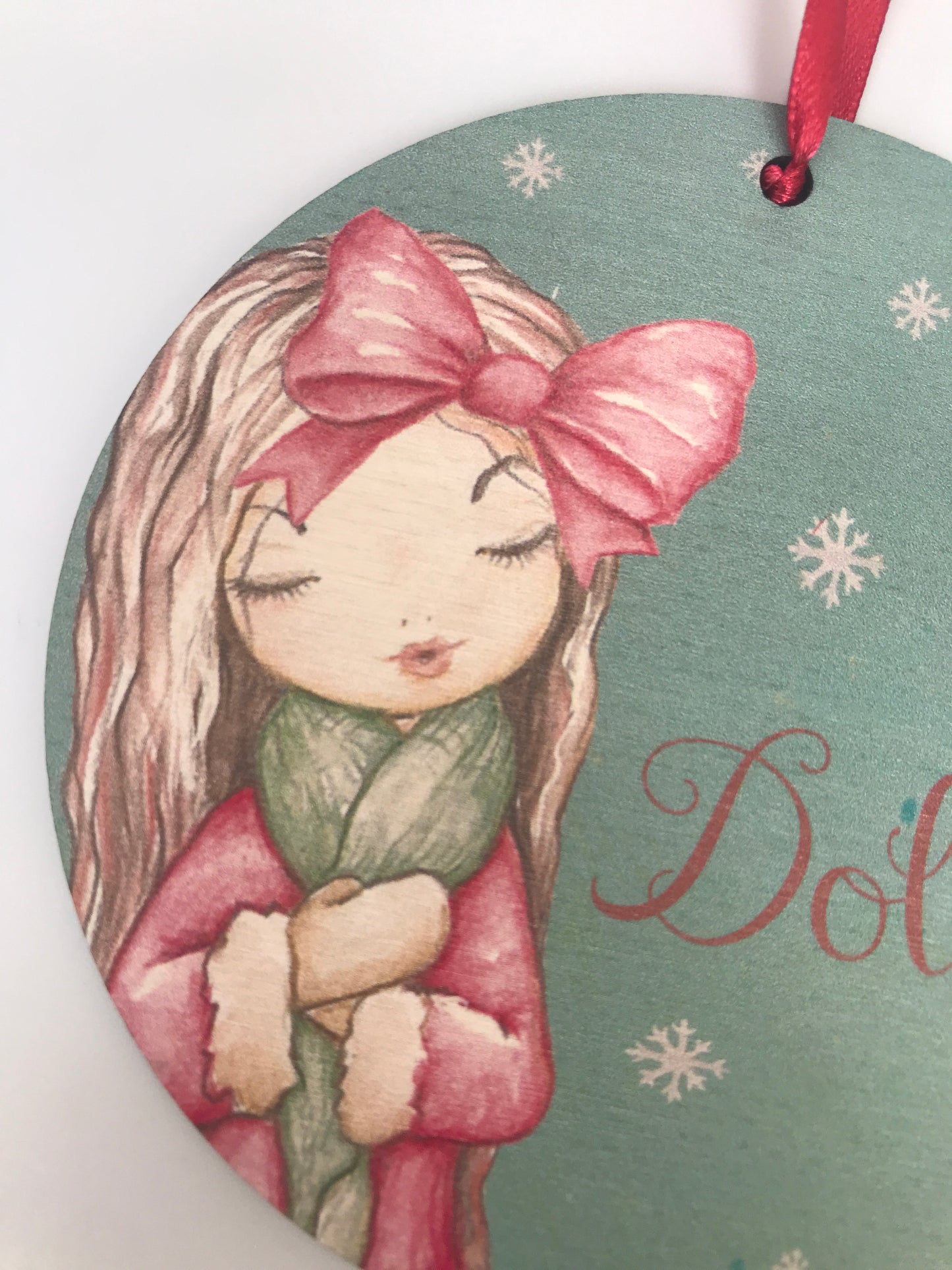 Woodland girl hanging Christmas decoration