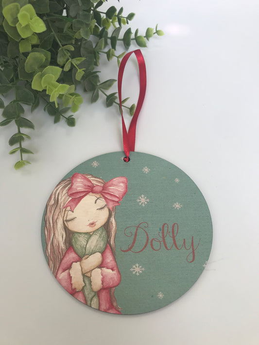 Woodland girl hanging Christmas decoration